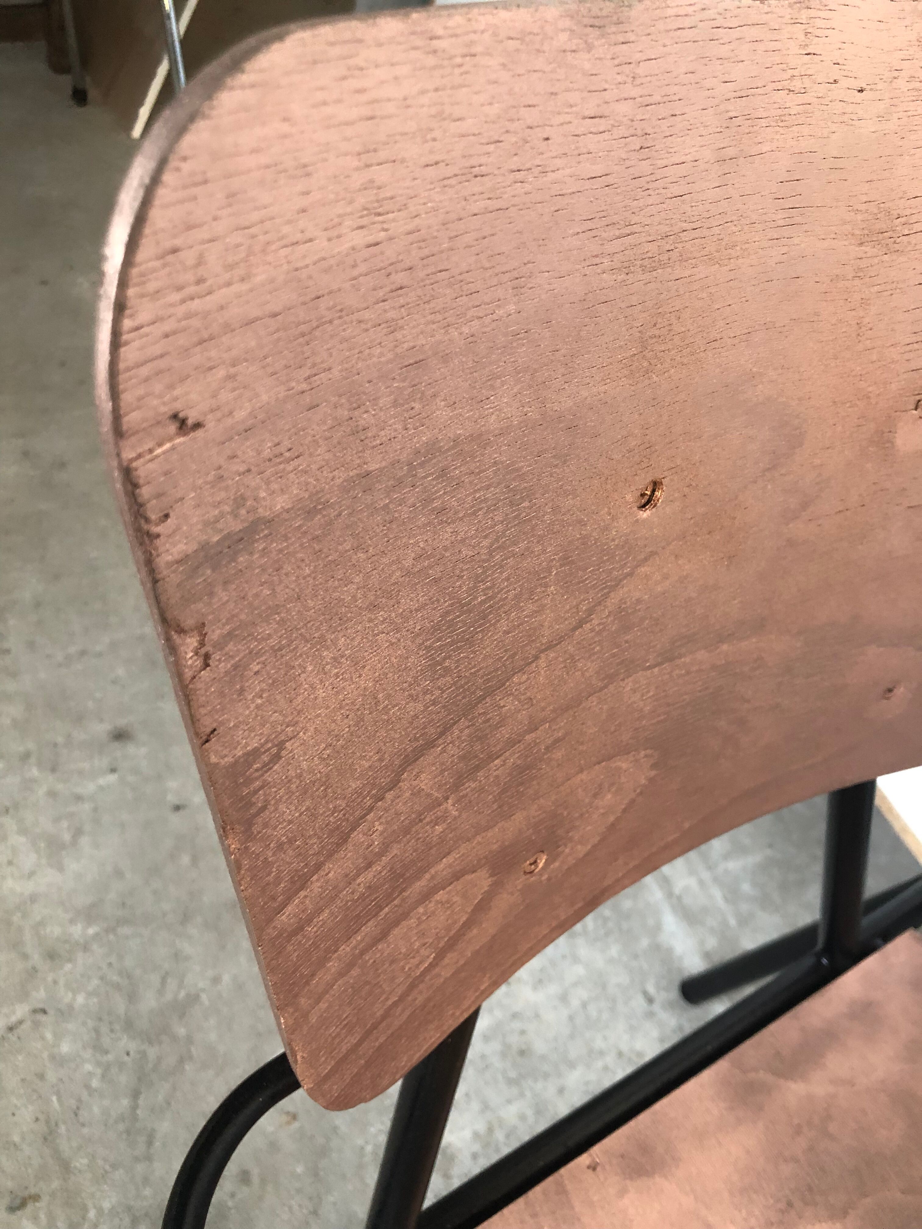 Old chair with armrest restored in metallic pink