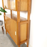 Vintage wooden showcase with sliding doors and white handles