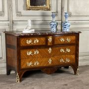Louis XV style commode in rosewood and palisander veneer, gilt bronze mounts, and Rance marble top.