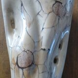Beige colored vase from the vallauris brand with flower pattern