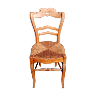 Antique wooden chair seated straw mustache