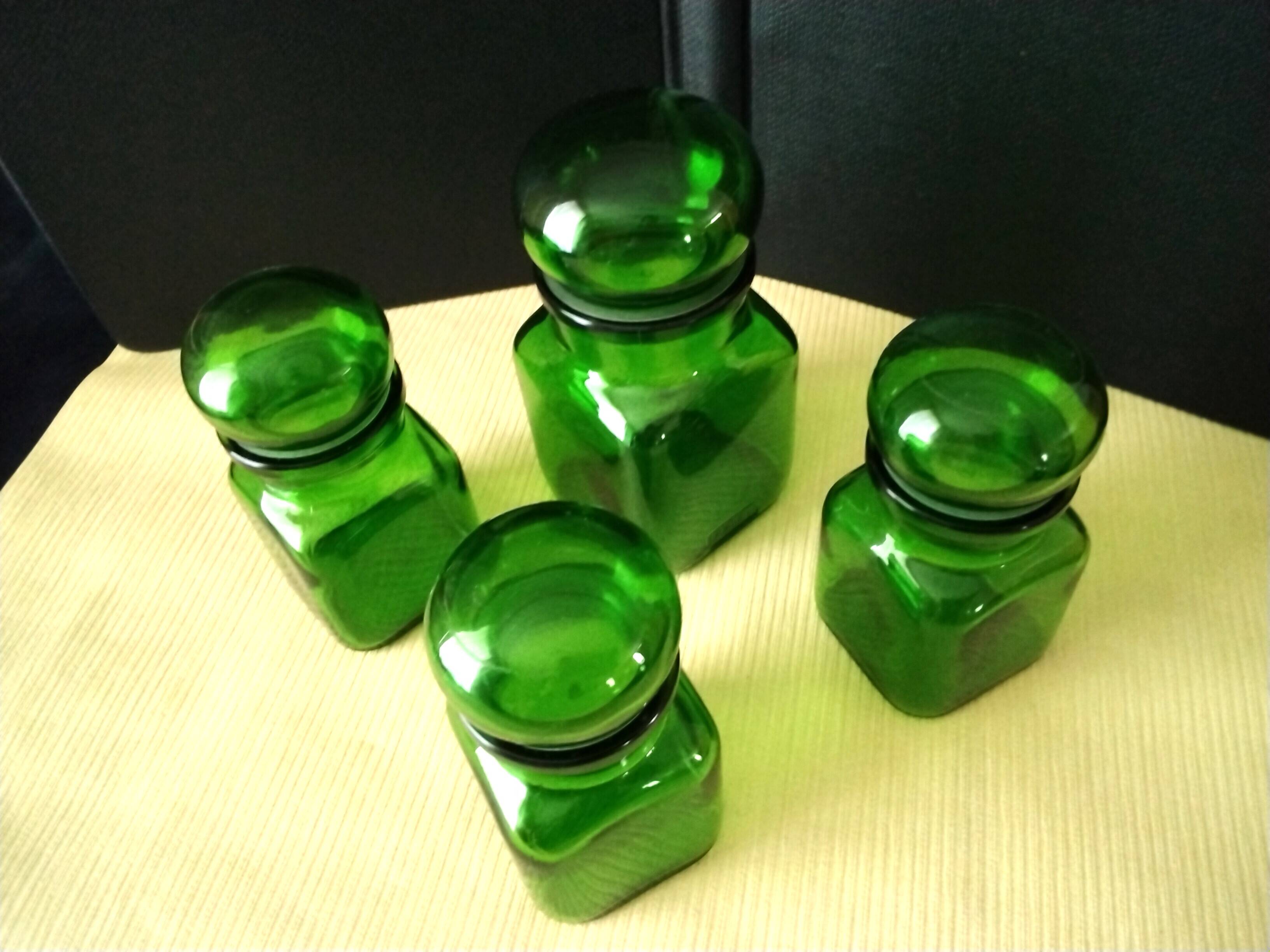 Set of 4 green glass jars, bottles from the 1970s.