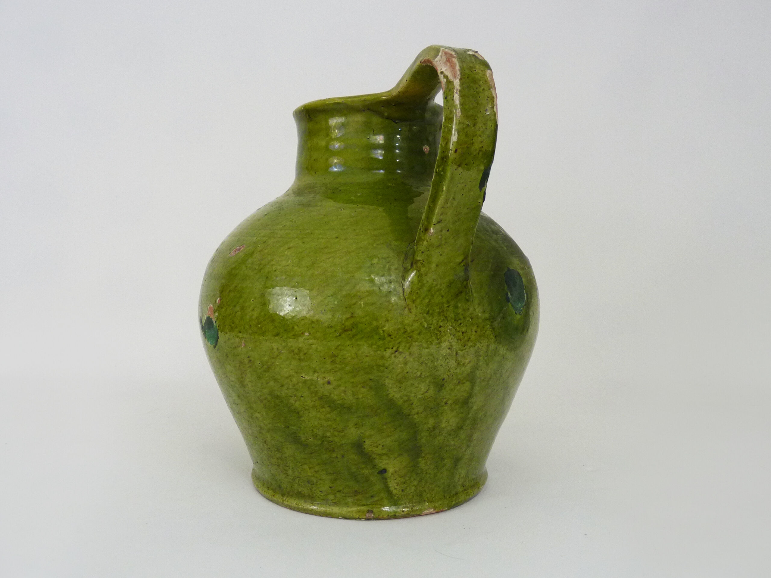 Orjol water pitcher pottery in green glazed terracotta. Pyrenees XIXth