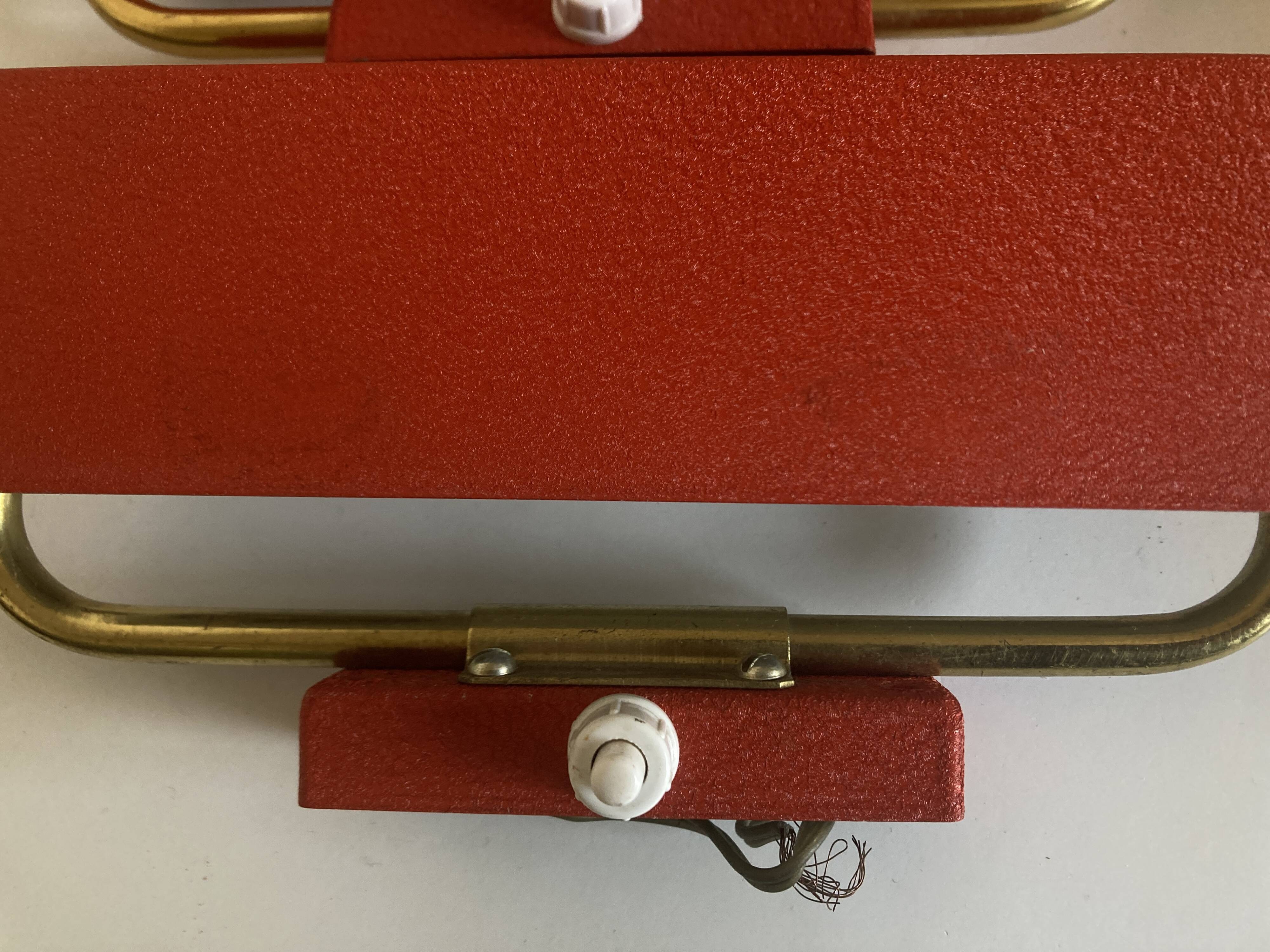 Pair of modernist swivel wall lights in red sheet metal, 1950s