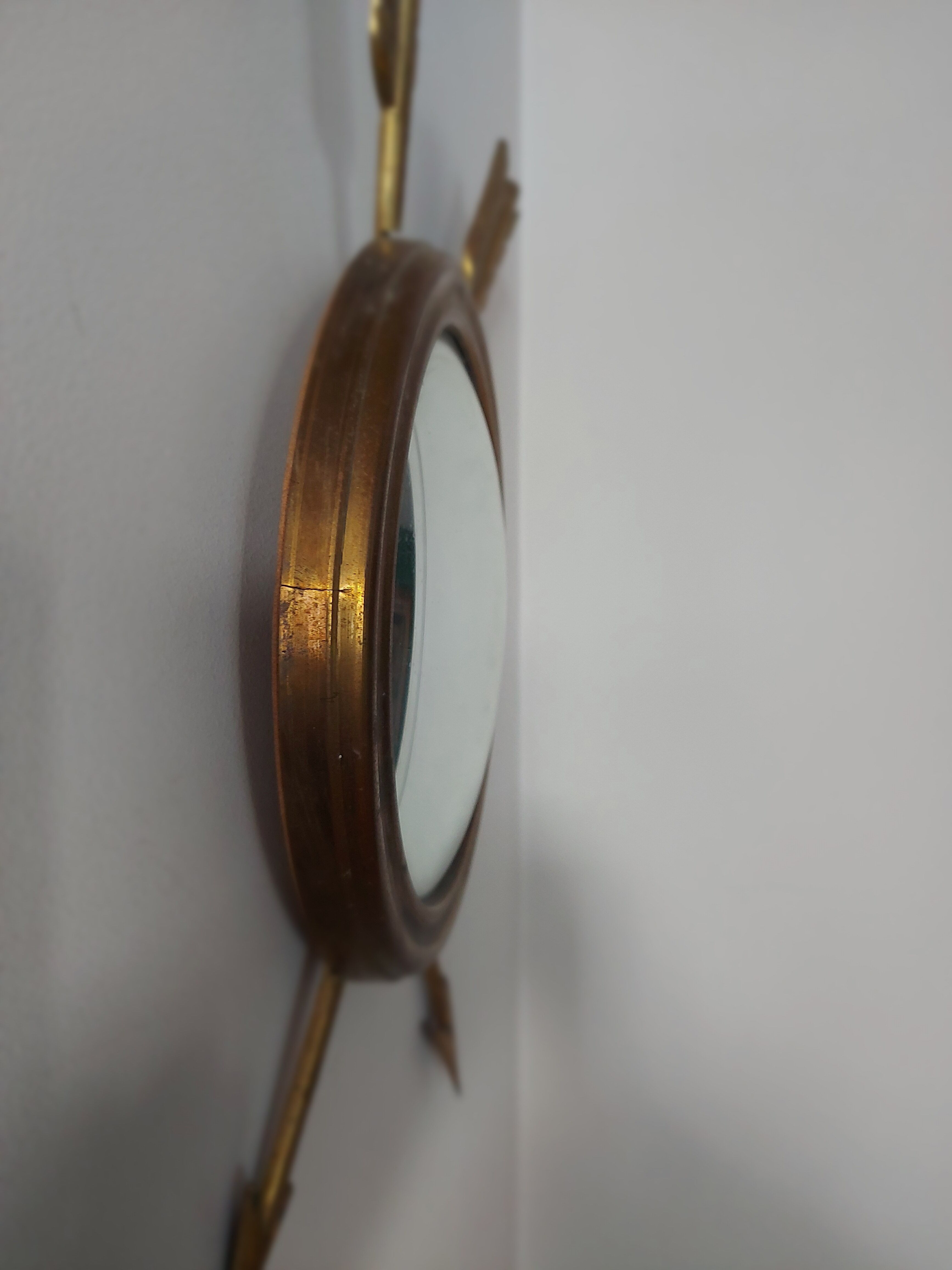 Curved brass witch's mirror