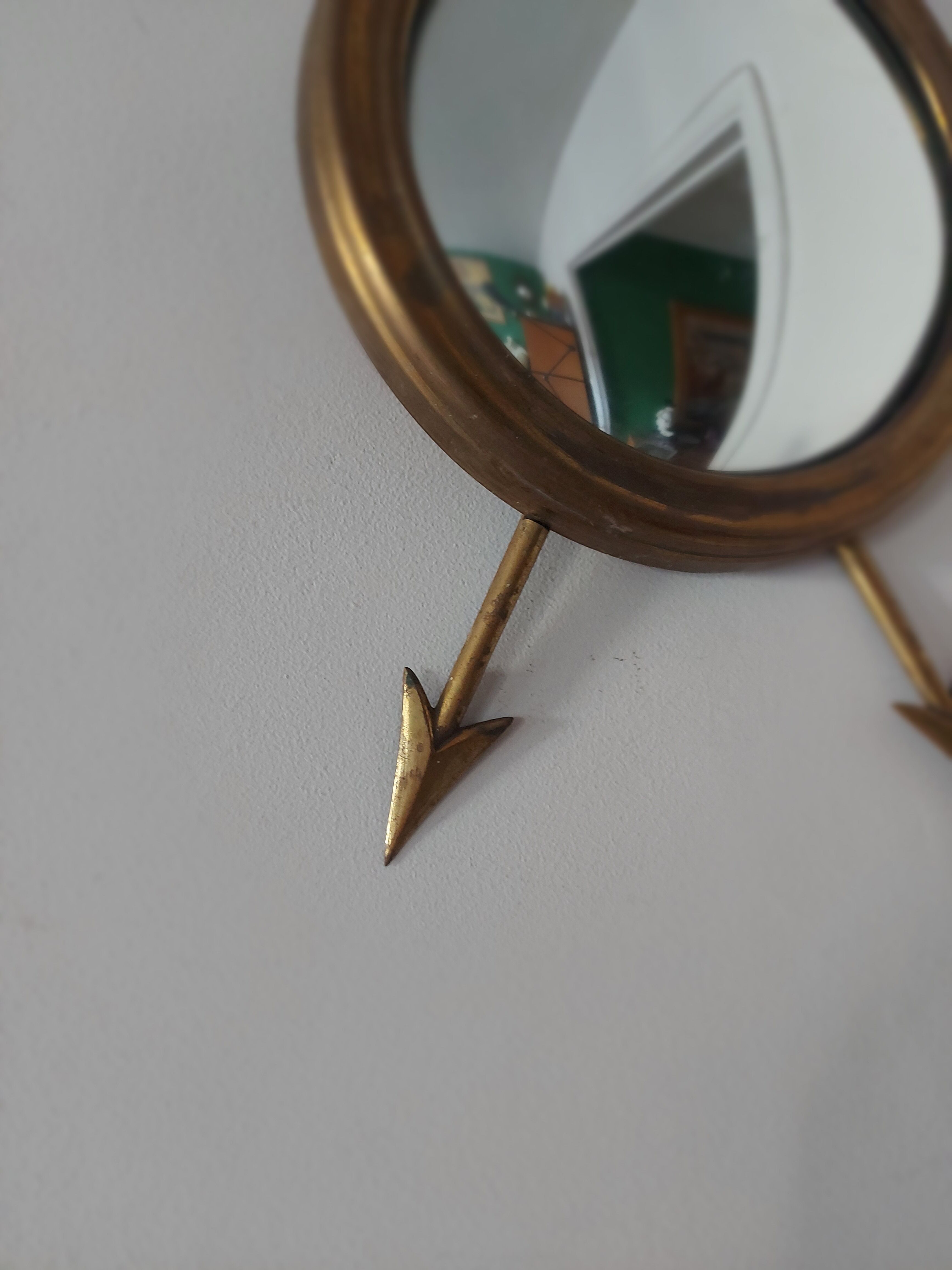 Curved brass witch's mirror