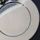 Vintage silver-plated round service tray with embossed cherries.