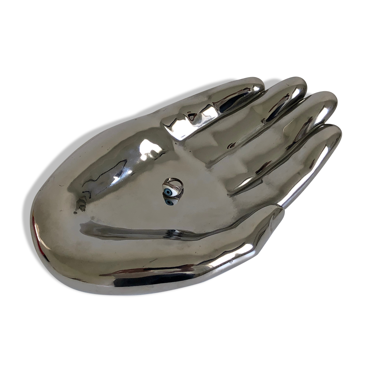 Empty silver chromed ceramic pocket in the shape of a large hand, 1980