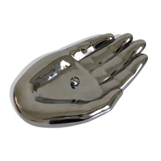 Empty silver chromed ceramic pocket in the shape of a large hand, 1980