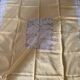 Tablecloth and 12 straw-colored napkins from the 50s.