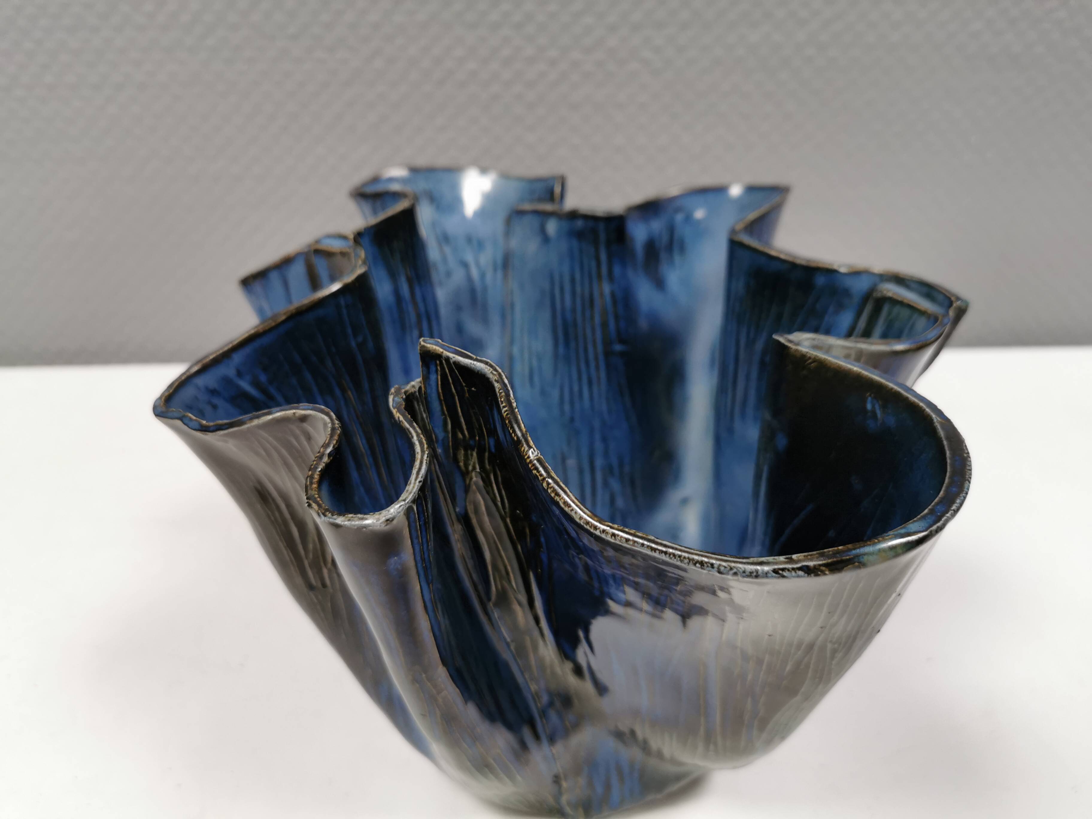 Very special vase in “folded” bluish glazed clay.