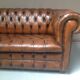 Upholstered chesterfield brown sofa
