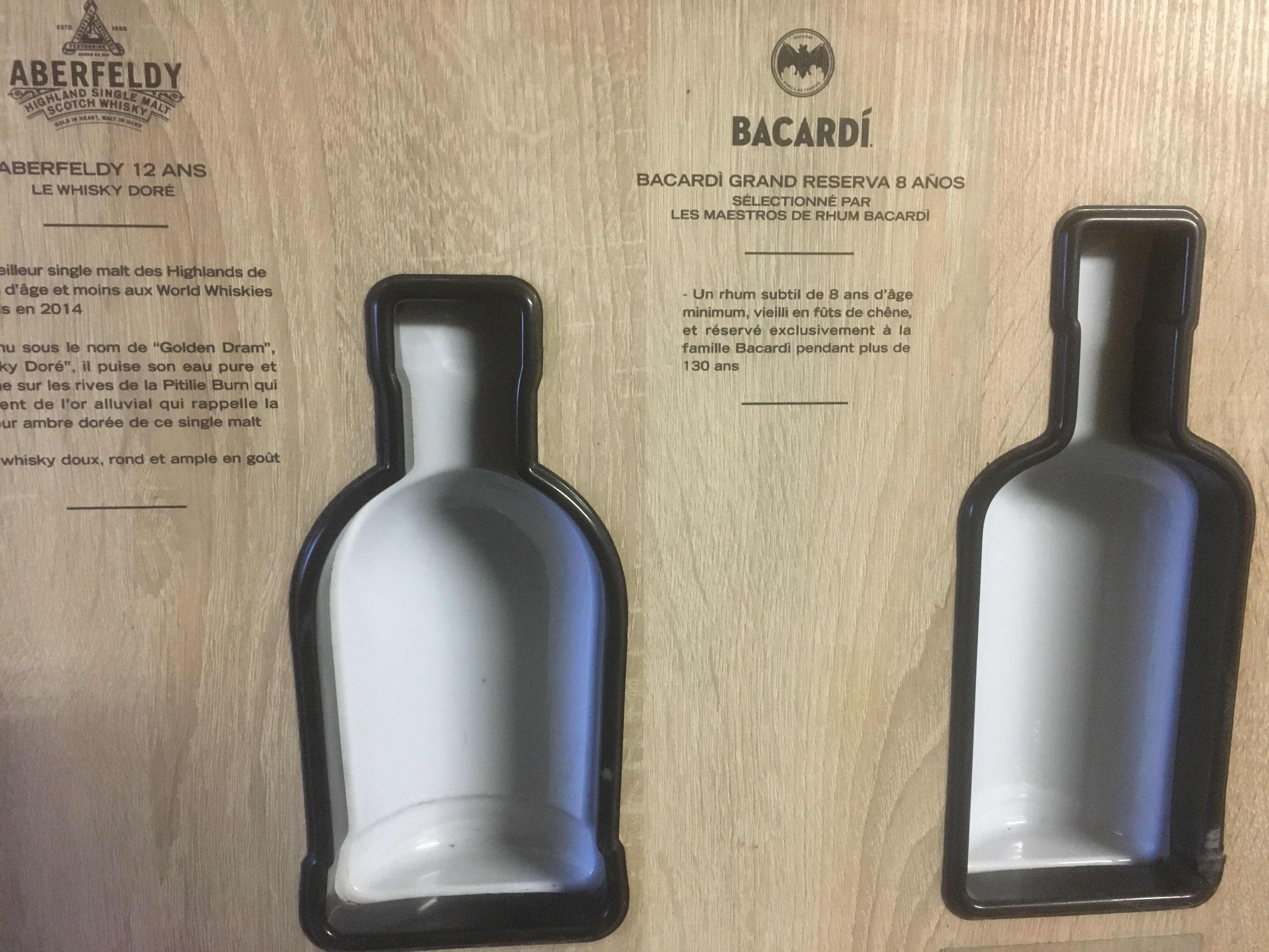 Store display for whisky and rum in metal and melamine