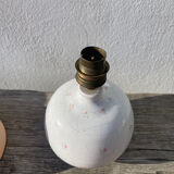 Small cracked white ceramic lamp with flowers.