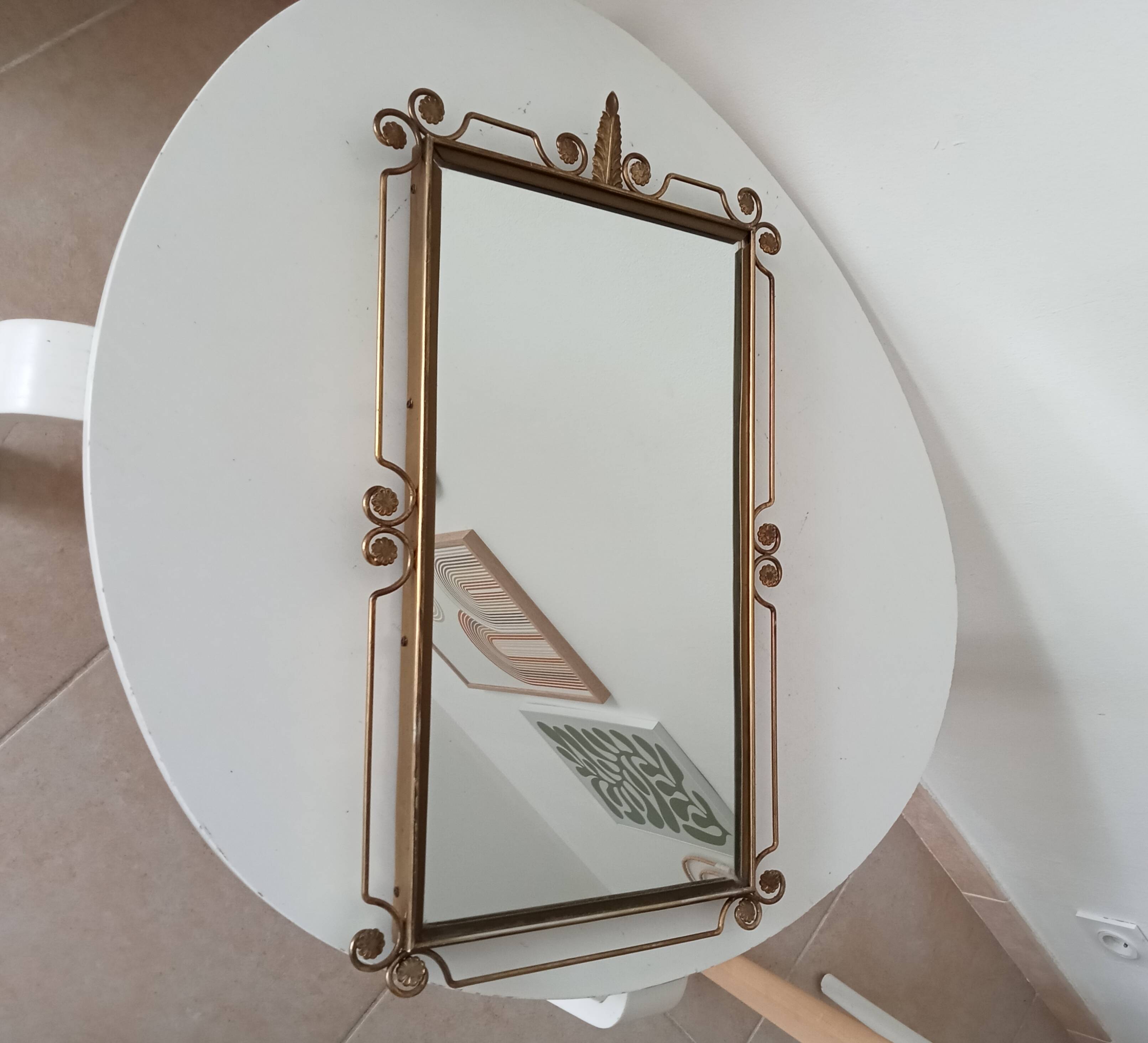 Vintage Hollywood Regency mirror from the 1950s.