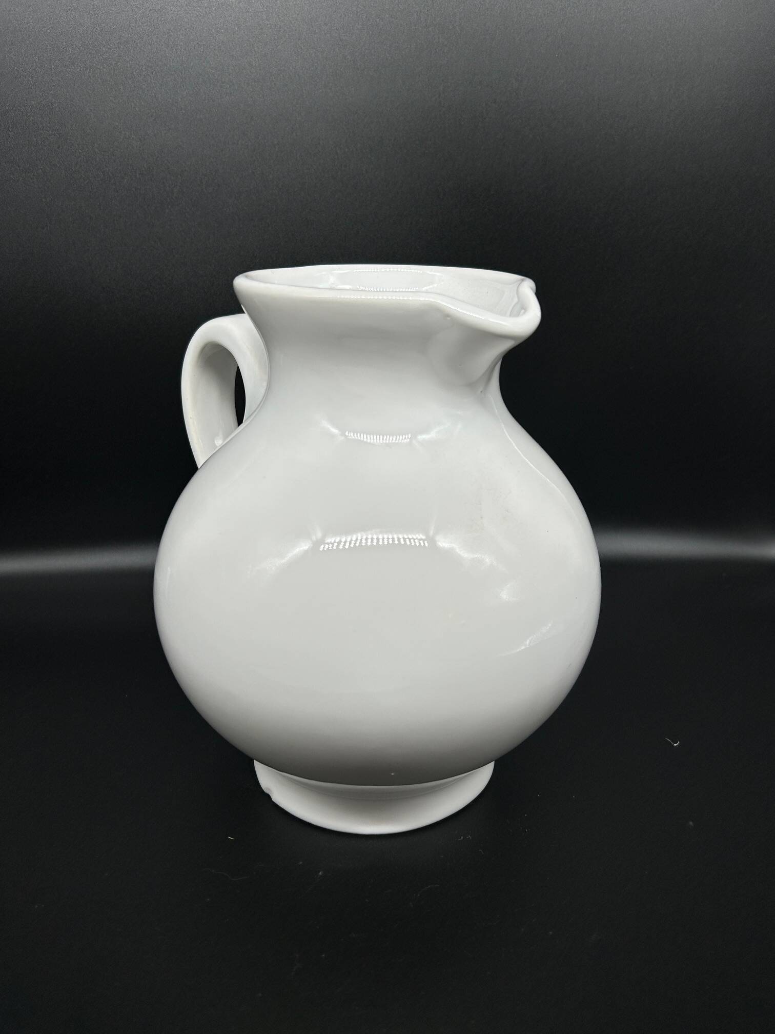 white ceramic cherry jug