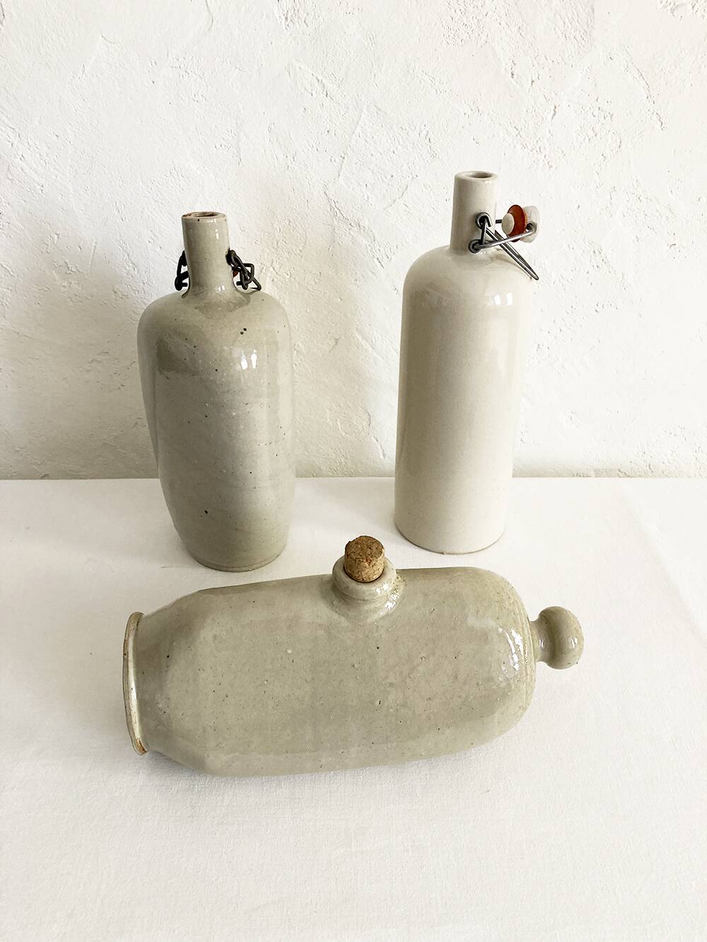 Trio of stoneware hot water bottles, three models