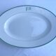 Antique oval plate with green monogram