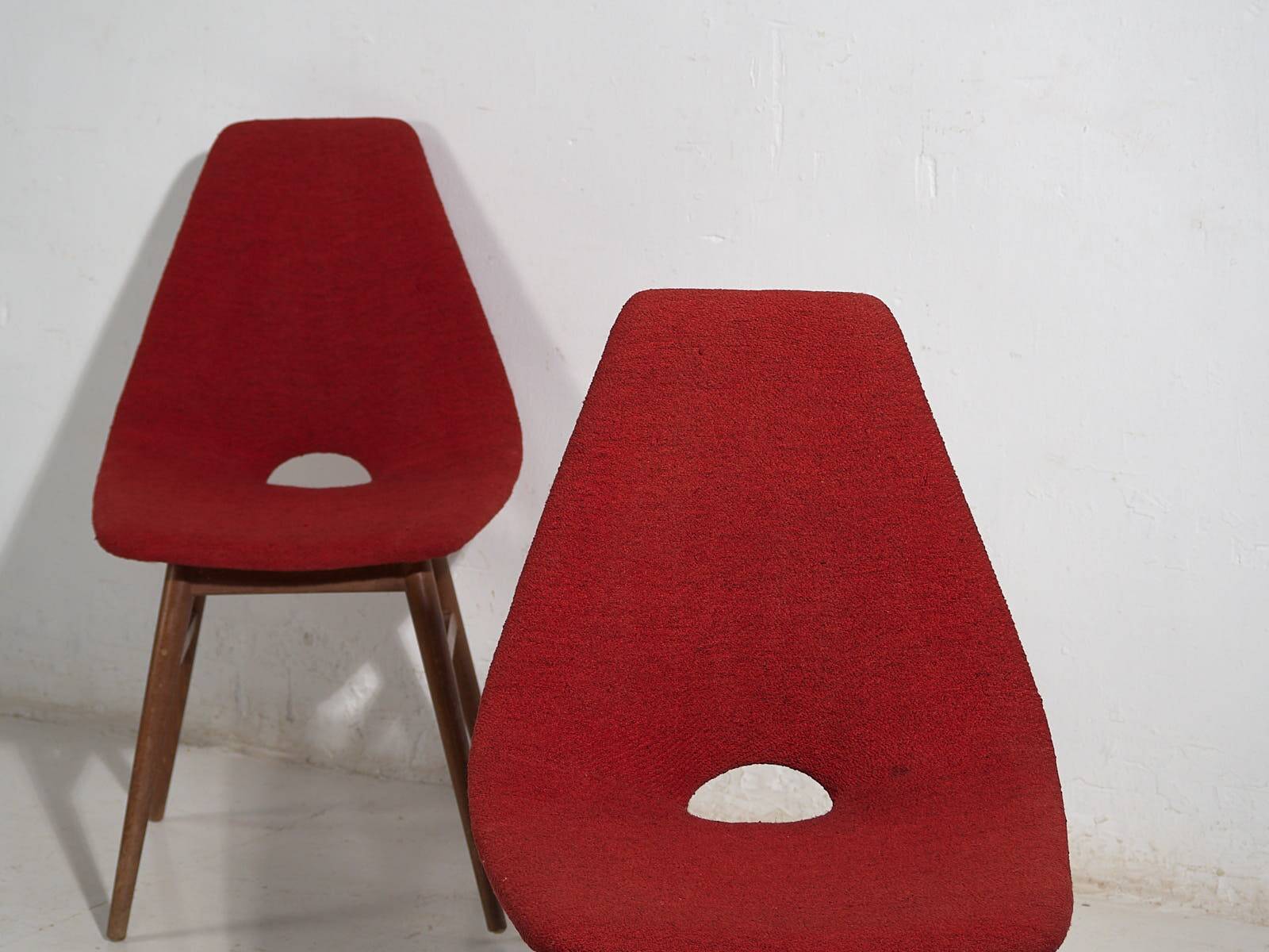 Wooden chairs with burgundy red fabric, circa 1950