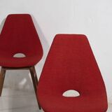 Wooden chairs with burgundy red fabric, circa 1950