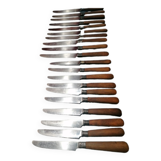 Old table knives and dessert knives, wooden handles, stainless steel blades