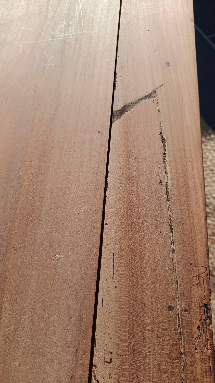 Low farmhouse table in raw wood