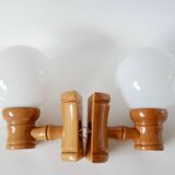 Pair of globe wall lights in pine and opaline from the 60s