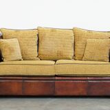Luxurious and spacious two-seater sheepskin sofa of top quality with fabric cushions