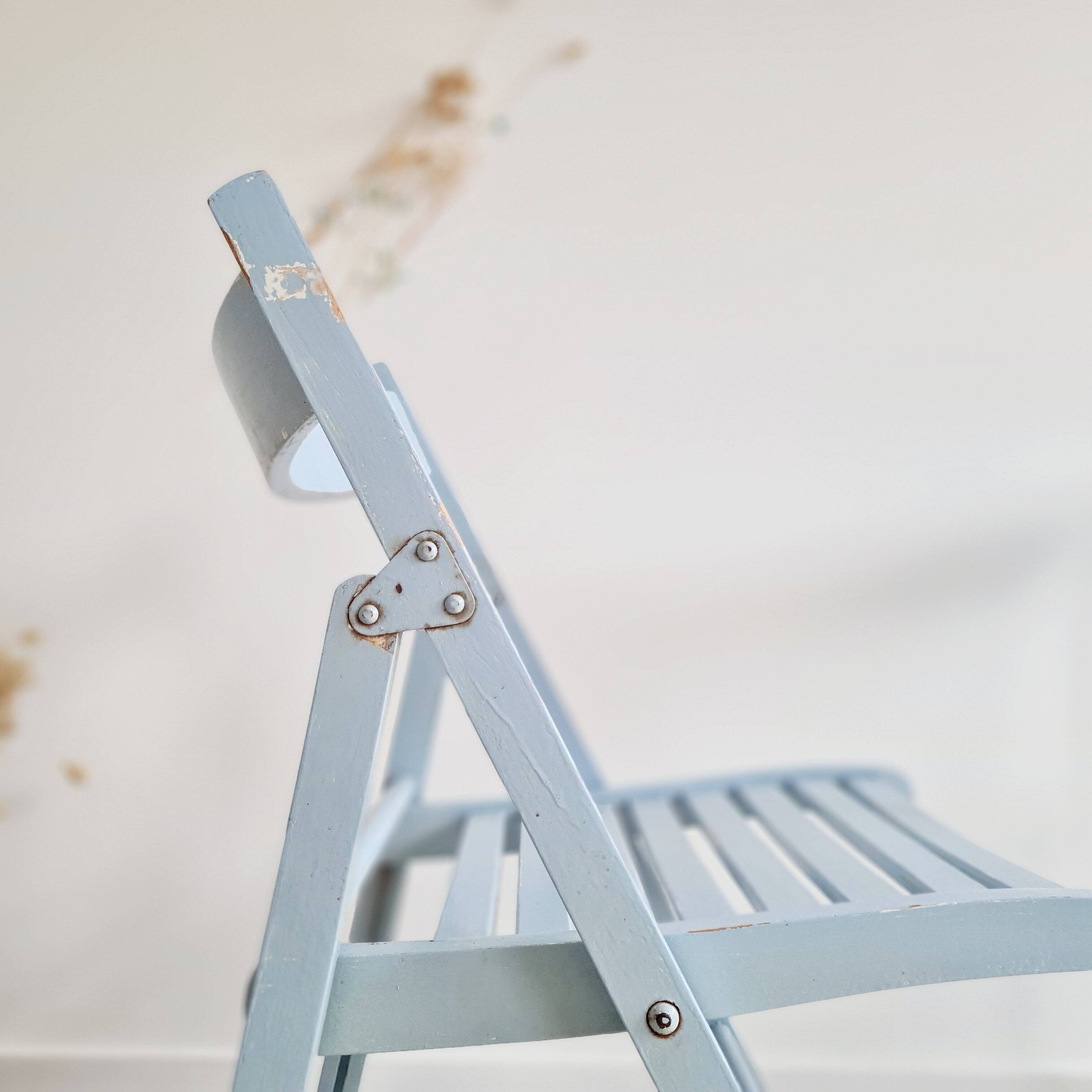 Blue folding chairs in lacquered wood