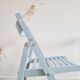 Blue folding chairs in lacquered wood