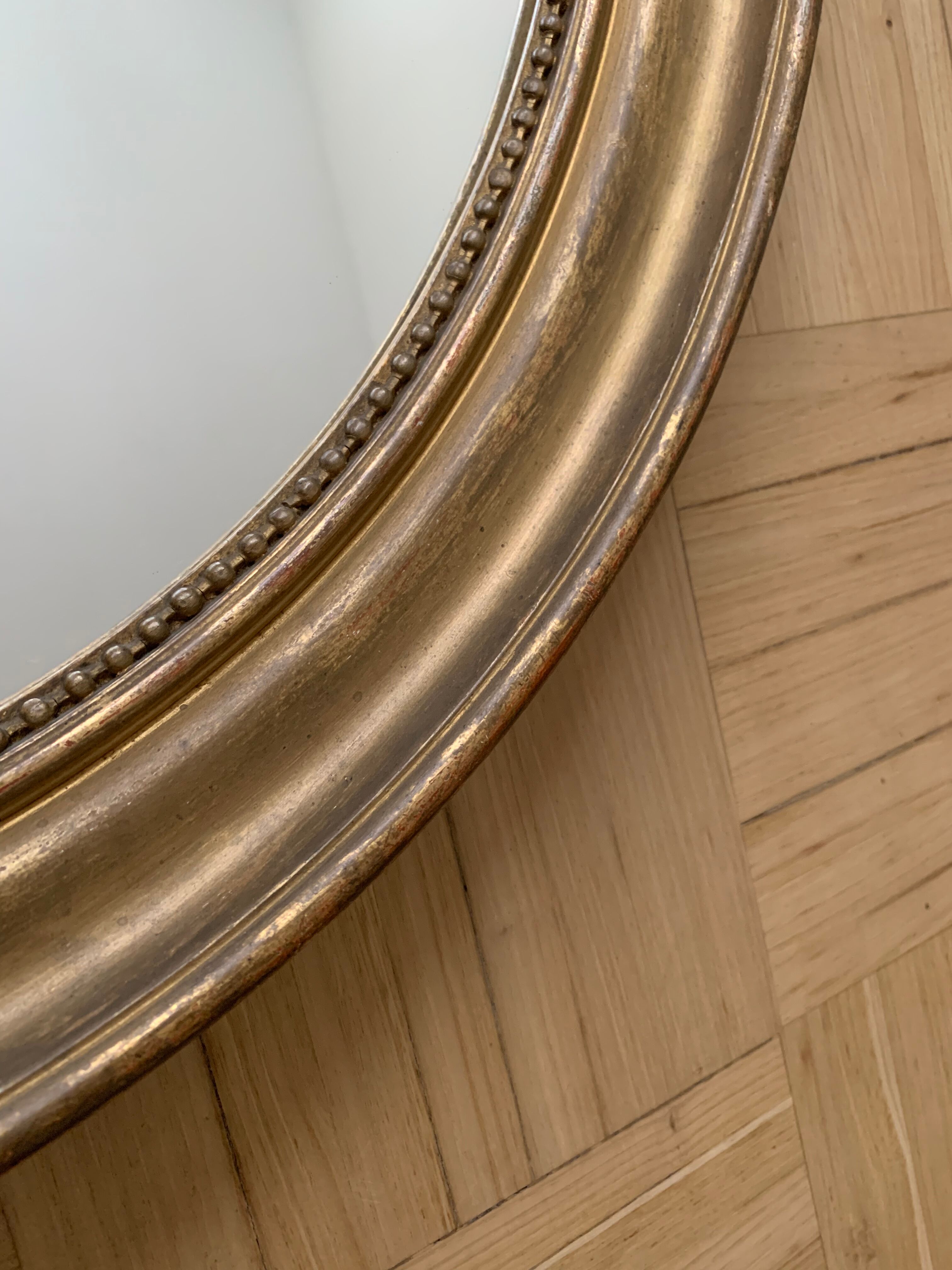 Old oval golden mirror