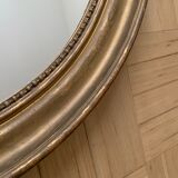 Old oval golden mirror