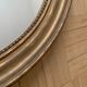 Old oval golden mirror