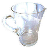 Blown glass pitcher decorated with small flowers
