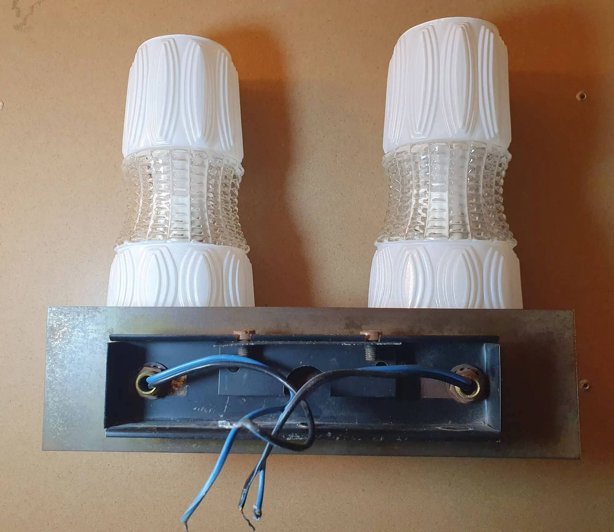 Vintage gold wall light on wooden stand