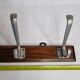 Wall rack "Art Deco" in cast aluminum and wood, 3 hooks, 54 cm