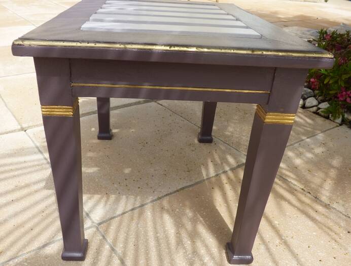 Coffee table or side table in style with its brass strips totalem.