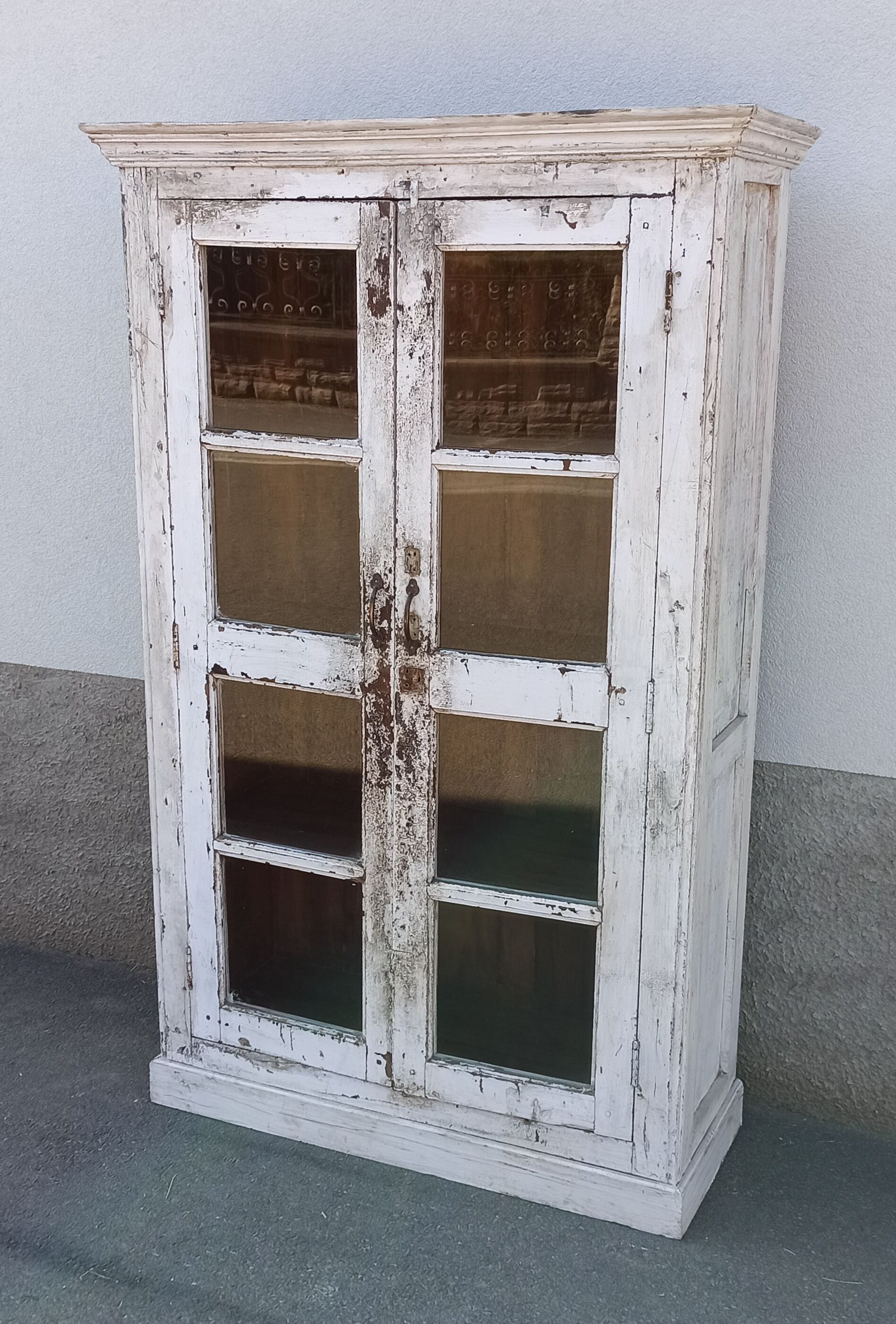 White wooden antique glazed wardrobe