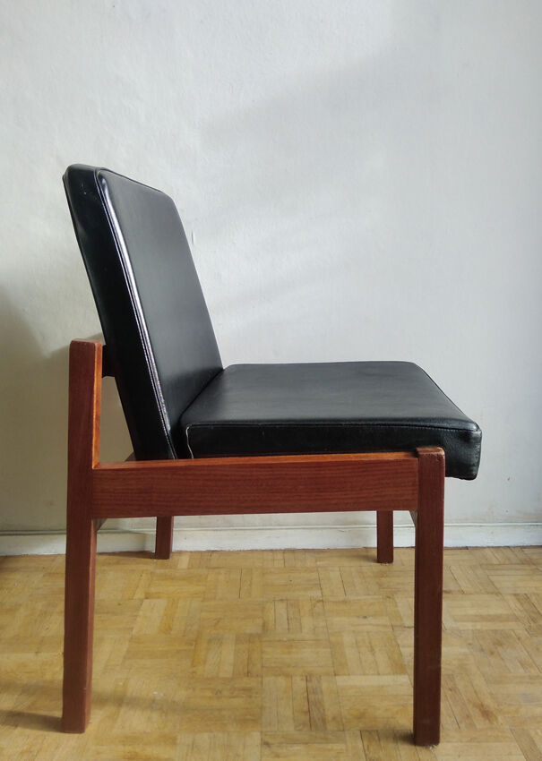 Massive teak and black skai armchair from the 1960s