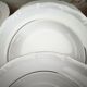 12 deep plates in porcelain with double gold trim.