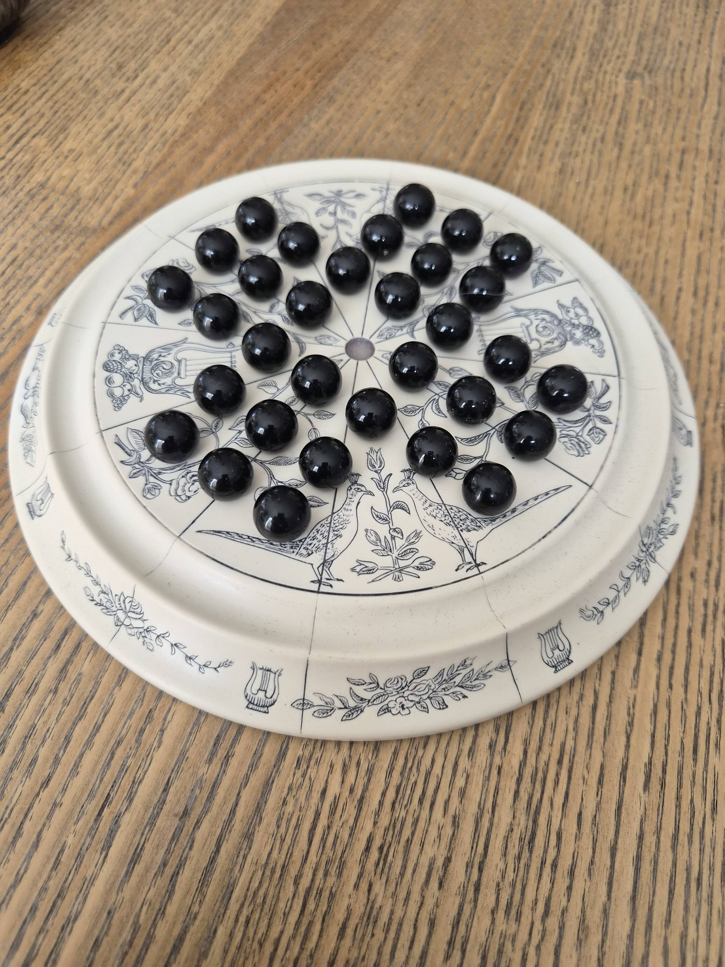 Ceramic solitaire game