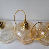 Trio of amber glass pendant lights