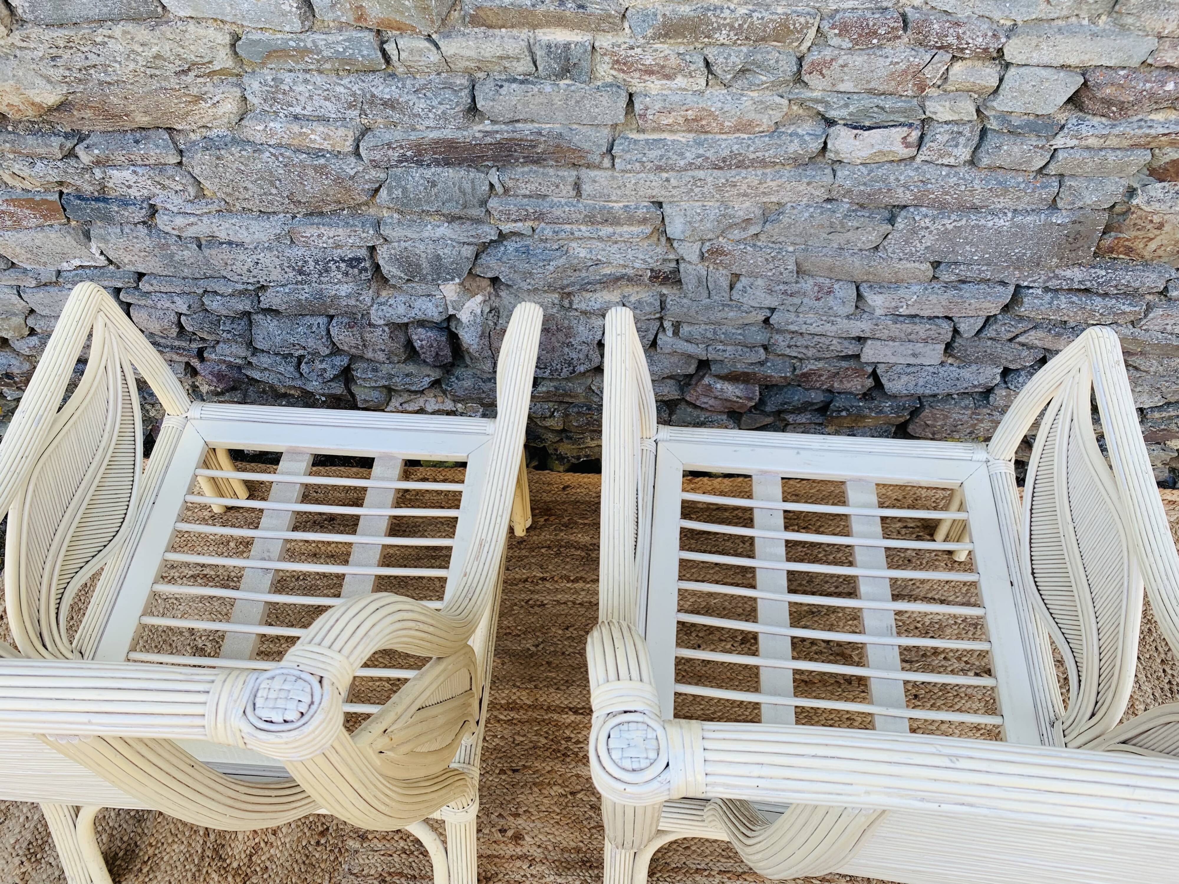 Pair of white rattan armchairs