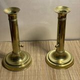 Duo de bougeoirs poussoir en laiton
