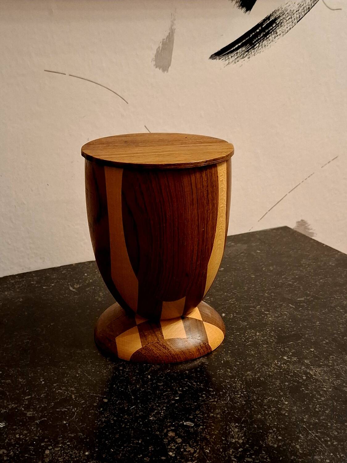 Bookends in exotic wood marquetry in the shape of a tambourine.