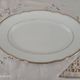 Oval plate in white Swiss porcelain double gilded border "VSK USC Viribus Unitis"