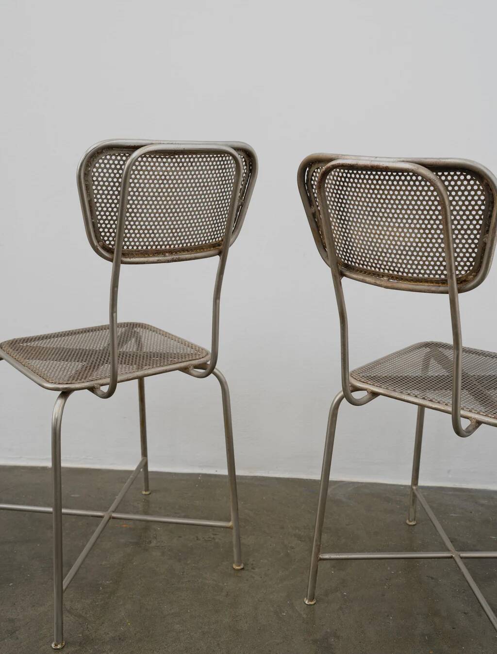 Vintage perforated metal chairs