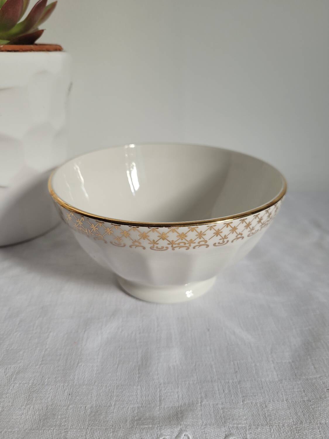 Opaque porcelain bowl with gold trim