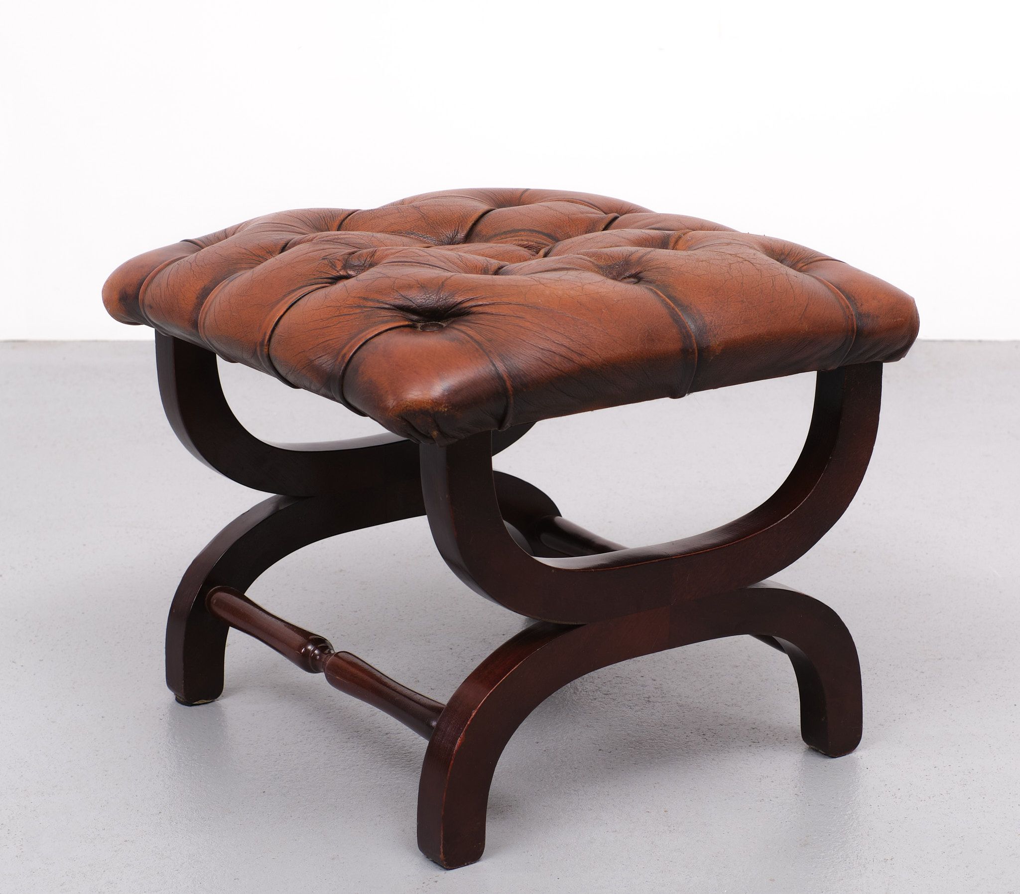 English country house style padded leather ottoman