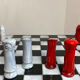 Chess set with ceramic board and pieces.